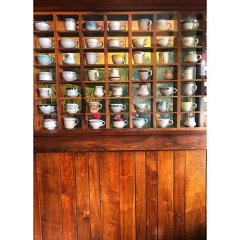 Sunrise Cafe - Wall of antique tea cups. So cute! - New American Near Me - Yellow Springs, Ohio