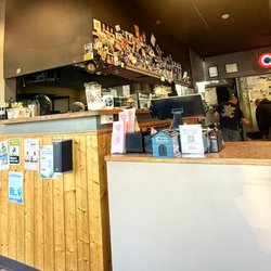 Spiro's Pizza and Pasta - Front door area to order/sit to wait and kitchen.
