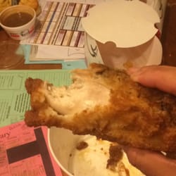 KFC - Already eaten chicken that was placed in the bucket we ordered.