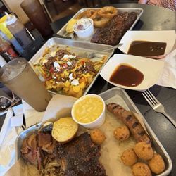 The Burnt End - Sampler platter (lower) loaded burnt end chips (middle) smoked pork steak (top)