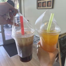 Brown sugar milk tea and mango green tea with mango boba Brown sugar milk tea and mango green tea with mango boba