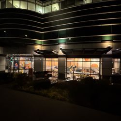 McDonald's - Outside of bldg across from space needle.   Good luck finding parking.  As there is a parking area across street or paid street parking.