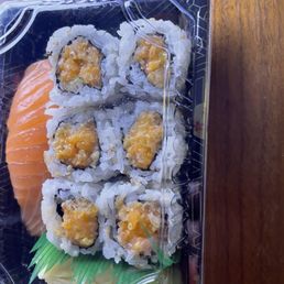 Spicy salmon roll with a single nigiri salmon sushi