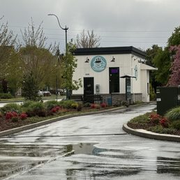Coffee stand across the parking lot. There is also a fenced in seating area that is dog-friendly.