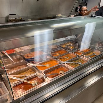 Maya Cafe - a man standing in front of a buffet - Breakfast & Brunch Near Me - San Antonio, Texas Maya Cafe - a man standing in front of a buffet - Breakfast & Brunch Near Me - San Antonio, Texas