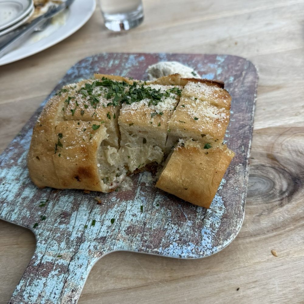 Bocca Italian Kitchen - Garlic bread. Does not look as good as it tastes ! Garlic butter oozes out of the bottom. Delish! - Italian Near Me - Houston, Texas