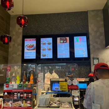 Sarku Japan - a man ordering food at a fast food restaurant - Sushi Bars Near Me - Santa Clara, California Sarku Japan - a man ordering food at a fast food restaurant - Sushi Bars Near Me - Santa Clara, California
