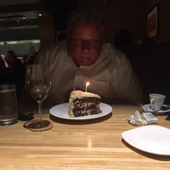Devon Seafood & Steak - It was my birthday and I was blowing out the candle on my cake ! Trying to make my girls laugh - Seafood Near Me - Oakbrook Terrace, Illinois