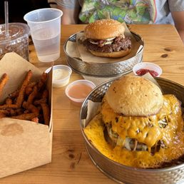 Classic skirted burger, the hangover burger and sweet potato fries. Classic skirted burger, the hangover burger and sweet potato fries.