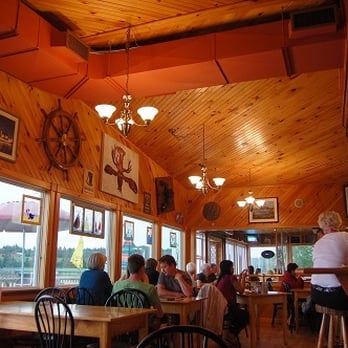 Carr's Oyster Bar - people sitting at tables - Seafood Near Me - Stanley Bridge, Prince Edward Island Carr's Oyster Bar - people sitting at tables - Seafood Near Me - Stanley Bridge, Prince Edward Island