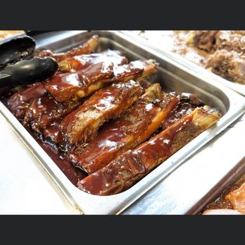 Magic City Grille - a tray of ribs with barbecue sauce - Soul Food Near Me - Bessemer, Alabama Magic City Grille - a tray of ribs with barbecue sauce - Soul Food Near Me - Bessemer, Alabama