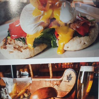 The Maple Leaf - This is the picture outside the Maple Leaf that drew us in. We ordered this exact meal! Check out the eggs benedict and the flower garnish! - Canadian (New) Near Me - Banff, Alberta