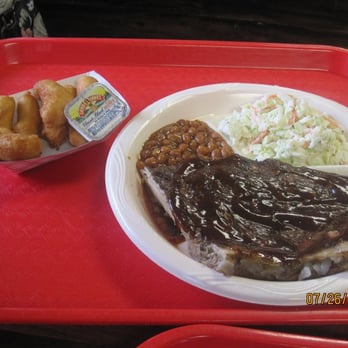 Pigman's Barbeque - Half Rack Rib Plate: comes with hushpuppies, coleslaw and baked beans. $12.99. - Sandwiches Near Me - Kill Devil Hills, North Carolina Pigman's Barbeque - Half Rack Rib Plate: comes with hushpuppies, coleslaw and baked beans. $12.99. - Sandwiches Near Me - Kill Devil Hills, North Carolina