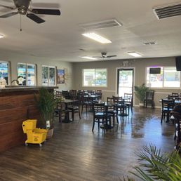 Inside of the restaurant. The door across is the front door. Inside of the restaurant. The door across is the front door.