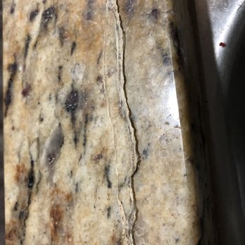 Set In Stone Restoration - Improper seal caused the crack to reappear. Color of granite was not matched from the repair either. - Flooring Near Me - San Diego, California