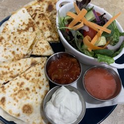 The Sea Biscuit Cafe & Eatery - Quesadilla with side salad and our homemade strawberry vinaigrette!
