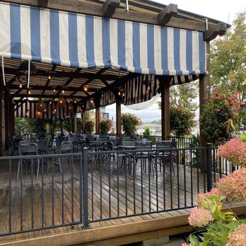 Ellicottville Brewing - a patio with tables and chairs - Brewpubs Near Me - Bemus Point, New York