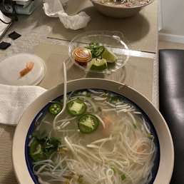 a bowl of soup with noodles and vegetables a bowl of soup with noodles and vegetables