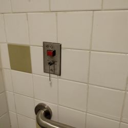 Fredericksburg Health and Rehab - This is the call button cord to alert the nurse for assistance in the bathroom of room 18 at the Fredericksburg Health and Rehab center.