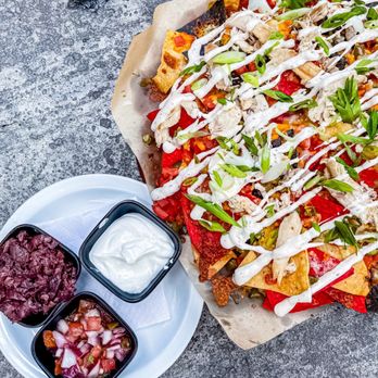 Hunter's Public House - a plate of nachos and dips - Pubs Near Me - Gloucester, Ontario