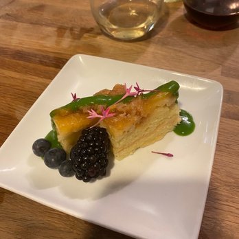 R Kitchen - Revamped pineapple upside down cake. Edible flower and basil cream garnish - New American Near Me - Charleston, South Carolina R Kitchen - Revamped pineapple upside down cake. Edible flower and basil cream garnish - New American Near Me - Charleston, South Carolina