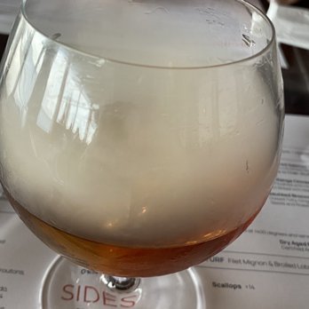 Rusty Pelican - Smoked old fashioned with wood ford reserve, simple syrup, walnut butters and served in a smoked glass. Yummy!! - Seafood Near Me - Tampa, Florida