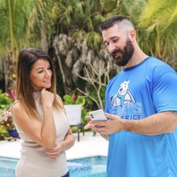 Terry's Pool Service - Terry's Pool Technician sharing pool chemical readings with a customer.