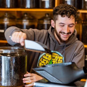 Ahrre's Coffee Roastery - a man pouring coffee into a jar - Coffee Roasteries Near Me - Westfield, New Jersey Ahrre's Coffee Roastery - a man pouring coffee into a jar - Coffee Roasteries Near Me - Westfield, New Jersey
