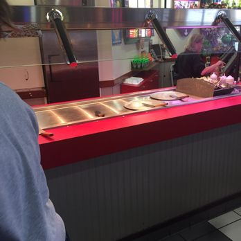 Chuck E. Cheese - a man and a woman in a restaurant - Pizza Near Me - York, Pennsylvania
