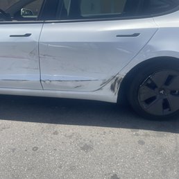 Side panel damage on Tesla