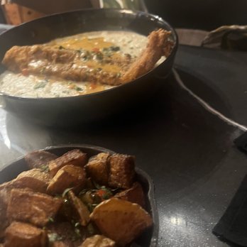Smith and Webster - Creamy grits with Catfish, Rustic potatoes with onions. For drinks we had peach lemonade  10/10! - Southern Near Me - Miami, Florida