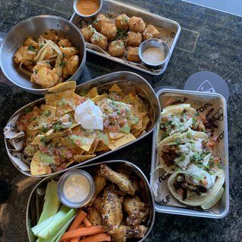 Topgolf - Tasty spread: Macaroni bites, sweet crispy shrimp, nachos, Asian sesame wings, tacos. Definitely repeat order shrimp and wings - Golf Near Me - San Jose, California
