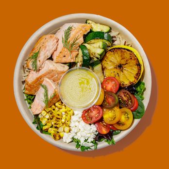 Roadtrip Bowls - a bowl of salad with salmon, corn, tomatoes, corn, tomatoes, and a dressing - Salad Near Me - Westminster, Colorado