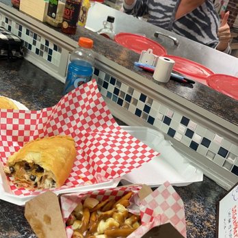Nellies pizza - Regular Poutine, Panzos - Chicken Wings Near Me - Myrtle Beach, South Carolina Nellies pizza - Regular Poutine, Panzos - Chicken Wings Near Me - Myrtle Beach, South Carolina