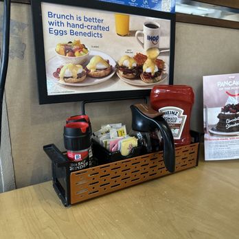 IHOP - a coffee maker and a menu on a table - Breakfast & Brunch Near Me - Mount Pleasant, Michigan IHOP - a coffee maker and a menu on a table - Breakfast & Brunch Near Me - Mount Pleasant, Michigan