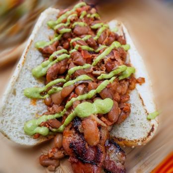 Los Miguels - a hot dog covered in guacamole - Food Stands Near Me Los Miguels - a hot dog covered in guacamole - Food Stands Near Me