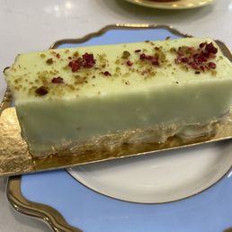 Pistachio raspberry dessert, I believe the coating was white chocolate Pistachio raspberry dessert, I believe the coating was white chocolate