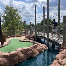 Hole overlooking the entire course with a river waterfall