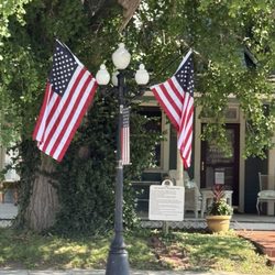 Plaque and flags under Ginkgo Tree