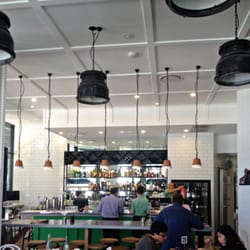 Buzz Gasworks - Subway tiles, industrial light fittings, pops of Kelly Green. Beautifully on trend design!
