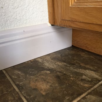 Empire Today - HUGE gap where moulding meets the cabinet, just filled with a metric ton of caulking. Really? - Flooring Near Me Empire Today - HUGE gap where moulding meets the cabinet, just filled with a metric ton of caulking. Really? - Flooring Near Me