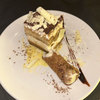 Amore E Amore - The assortment of homemade dessert plate - tiramisu, and a cannoli - Italian Near Me - Atlanta, Georgia Amore E Amore - The assortment of homemade dessert plate - tiramisu, and a cannoli - Italian Near Me - Atlanta, Georgia