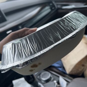 Chipotle Mexican Grill - a person holding a pan in a car - Mexican Near Me - Virginia Beach, Virginia Chipotle Mexican Grill - a person holding a pan in a car - Mexican Near Me - Virginia Beach, Virginia