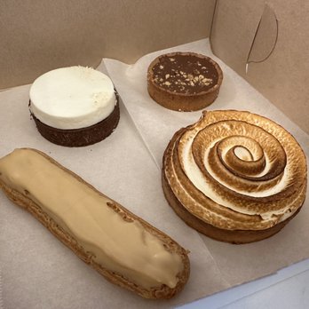 Left Bank Pastry - Coconut mousse tart, milk chocolate hazelnut tart, coffee eclair and lemon meringue tart! - Bakeries Near Me - Olympia, Washington Left Bank Pastry - Coconut mousse tart, milk chocolate hazelnut tart, coffee eclair and lemon meringue tart! - Bakeries Near Me - Olympia, Washington