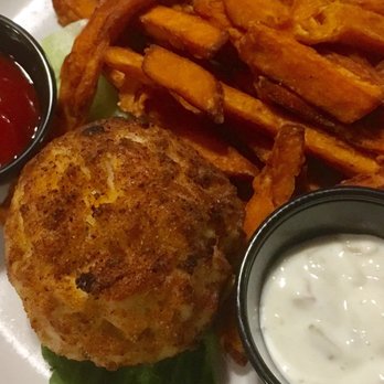 Foxy's Harbor Grille - Crab cake was not huge but was loaded with crab. Served here with sweet potato fries. Ask for honey to accompany the fries. Mmm - Seafood Near Me - St Michaels, Maryland Foxy's Harbor Grille - Crab cake was not huge but was loaded with crab. Served here with sweet potato fries. Ask for honey to accompany the fries. Mmm - Seafood Near Me - St Michaels, Maryland