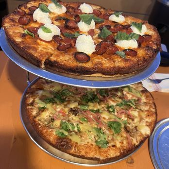 Mooney’s Pizza - Stacked pizzas - Pizza Near Me - Long Beach, California