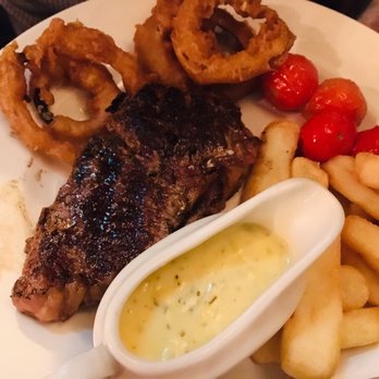 Sherlock Holmes - Steak with onion rings and fries - Pubs Near Me - London, XGL Sherlock Holmes - Steak with onion rings and fries - Pubs Near Me - London, XGL