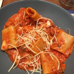 a plate of pasta with meat and cheese a plate of pasta with meat and cheese