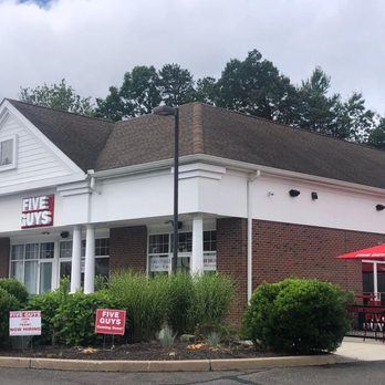 Five Guys - Exterior photograph of the Five Guys restaurant at 266-274 South Main Street in Newtown, Connecticut. - Burgers Near Me - Newtown, Connecticut Five Guys - Exterior photograph of the Five Guys restaurant at 266-274 South Main Street in Newtown, Connecticut. - Burgers Near Me - Newtown, Connecticut