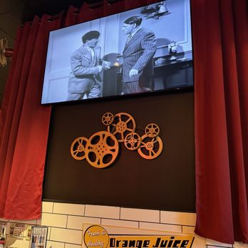 The Breakfast Spot - a large screen showing a movie - Breakfast & Brunch Near Me - Lake George, New York